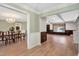Open-concept living and dining areas featuring hardwood floors, decorative molding, and plenty of natural light at 1602 Lake Shore Dr, Dunn, NC 28334