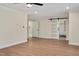 Main bedroom with hardwood floors, neutral walls, closet and bathroom access at 1602 Lake Shore Dr, Dunn, NC 28334