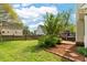 Spacious backyard with a wooden deck and lush greenery, providing a serene and private outdoor oasis at 1604 Cane Creek Dr, Garner, NC 27529