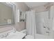 Clean bathroom featuring a shower-tub, vanity, and ample storage space at 1604 Cane Creek Dr, Garner, NC 27529
