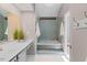 Bright bathroom featuring mosaic tiles, a soaking tub, and a modern vanity, offering a relaxing retreat at 1604 Cane Creek Dr, Garner, NC 27529