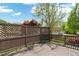 Spacious wooden deck surrounded by lush greenery, creating a serene outdoor space for relaxation and entertainment at 1604 Cane Creek Dr, Garner, NC 27529
