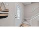 Bright foyer with a paneled door, staircase, and neutral decor at 1604 Cane Creek Dr, Garner, NC 27529