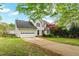 A home with a well-kept lawn, attached garage, and a traditional design at 1604 Cane Creek Dr, Garner, NC 27529
