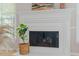 Close up of the fireplace with decorative molding and plant at 1604 Cane Creek Dr, Garner, NC 27529