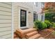 Close-up of a home's entrance featuring a decorative door and brick steps at 1604 Cane Creek Dr, Garner, NC 27529