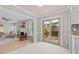 Open living space with a living room, dining area and access to the deck at 1604 Cane Creek Dr, Garner, NC 27529