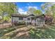 Lush backyard featuring a screened-in porch, patio, and mature trees at 1623 Alicary Ct, Cary, NC 27511