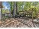 Picturesque backyard with a pergola, picnic table, beautiful landscaping, and a storage shed at 1623 Alicary Ct, Cary, NC 27511