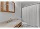 Well-lit bathroom featuring a vanity with wood cabinets and a shower-tub combination at 1623 Alicary Ct, Cary, NC 27511