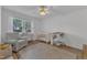 Comfortable Bedroom with hardwood floors, chair, crib, and natural light from a window at 1623 Alicary Ct, Cary, NC 27511