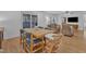 Open concept dining room features French doors to the exterior and living room seating at 1623 Alicary Ct, Cary, NC 27511
