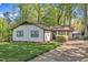 Quaint single-story home with a well-kept lawn, a simple shrub and a long driveway at 1623 Alicary Ct, Cary, NC 27511