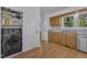 The laundry room also includes wood cabinets and granite countertops at 1623 Alicary Ct, Cary, NC 27511