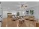 Spacious living room with hardwood floors, fireplace, ample seating, and abundant natural light at 1623 Alicary Ct, Cary, NC 27511
