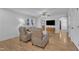 Cozy living room featuring hardwood floors, a ceiling fan, and comfortable seating at 1623 Alicary Ct, Cary, NC 27511