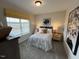Bedroom featuring a large window, a bed with patterned bedding, and artwork above the bed at 164 E Victory View. Ter, Smithfield, NC 27577