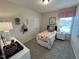 Bright bedroom features natural light and decorative accents at 164 E Victory View. Ter, Smithfield, NC 27577