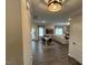 Open dining room with hardwood floors, neutral paint, modern lighting, and natural light at 164 E Victory View. Ter, Smithfield, NC 27577