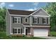 Charming two-story home with gray siding, black shutters, and a brick garage in a well landscaped neighborhood at 164 E Victory View. Ter, Smithfield, NC 27577