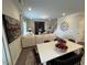 Bright living room showcasing an oversized canvas artwork with fireplace, L-shaped sofa and a table with fruit baskets at 164 E Victory View. Ter, Smithfield, NC 27577