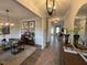 Inviting living room featuring modern lighting, neutral paint, hardwood floors, and an abundance of natural light at 164 E Victory View. Ter, Smithfield, NC 27577