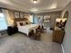 Expansive main bedroom features a tray ceiling, plush carpeting, and sitting area at 164 E Victory View. Ter, Smithfield, NC 27577
