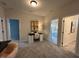 A home office featuring neutral walls, a modern desk, and views to the bedroom at 164 E Victory View. Ter, Smithfield, NC 27577
