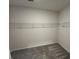 A simple walk-in closet offers ample storage space at 164 E Victory View. Ter, Smithfield, NC 27577