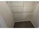 Walk-in closet with wire shelving and carpeted floor at 164 E Victory View. Ter, Smithfield, NC 27577