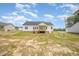 This single Gathering home features a porch, backyard and is surrounded by beautiful landscaping at 172 Royal Ave, Selma, NC 27576