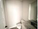 This bathroom has a granite countertop and white fixtures at 172 Royal Ave, Selma, NC 27576