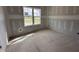 Bedroom featuring drywall, natural light from a large window, and ready for customization at 172 Royal Ave, Selma, NC 27576