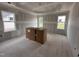 Bright bedroom showcasing a tray ceiling, drywall, and natural light from large windows at 172 Royal Ave, Selma, NC 27576