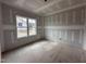 Bedroom under construction featuring drywall, and a large window at 172 Royal Ave, Selma, NC 27576