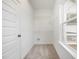 A walk-in closet with wire shelving and a window for natural light at 172 Royal Ave, Selma, NC 27576