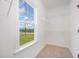 Walk-in closet with carpeted floor, wire shelving and a window at 172 Royal Ave, Selma, NC 27576