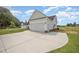 Spacious two-car garage featuring white doors, exterior lighting, and concrete driveway at 172 Royal Ave, Selma, NC 27576