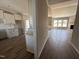Bright kitchen featuring white cabinets, granite countertops, and stylish backsplash at 172 Royal Ave, Selma, NC 27576