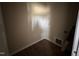 Small laundry room with hookups and wood-look flooring at 172 Royal Ave, Selma, NC 27576