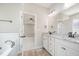 Main bathroom featuring dual vanities, granite countertops, and decorative lighting at 172 Royal Ave, Selma, NC 27576