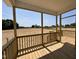 Covered porch with views of undeveloped land at 172 Royal Ave, Selma, NC 27576