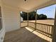 Covered porch overlooking undeveloped land at 172 Royal Ave, Selma, NC 27576