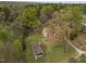 Aerial view of a home on a large lot with mature trees at 1823 E Geer St, Durham, NC 27704