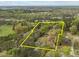 Aerial view of property with multiple buildings, surrounded by lush trees and greenery at 1823 E Geer St, Durham, NC 27704