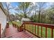 A beautiful backyard deck overlooking lush greenery and a quaint outbuilding at 1823 E Geer St, Durham, NC 27704