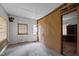 View of a basement room with simple windows and unfinished walls, providing renovation opportunities at 1823 E Geer St, Durham, NC 27704
