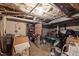 Unfinished basement area with exposed utilities and storage shelves at 1823 E Geer St, Durham, NC 27704