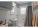 Tidy bathroom featuring white tile, a shower and tub combination, and vanity at 1823 E Geer St, Durham, NC 27704