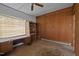 View of a bedroom with a desk, bookshelf, and built-in storage, offering functionality at 1823 E Geer St, Durham, NC 27704